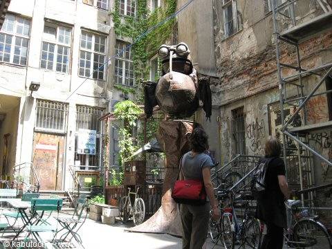 Metal claw sculpture with goggles in graffiti courtyard at Haus Schwarzenberg, Berlin