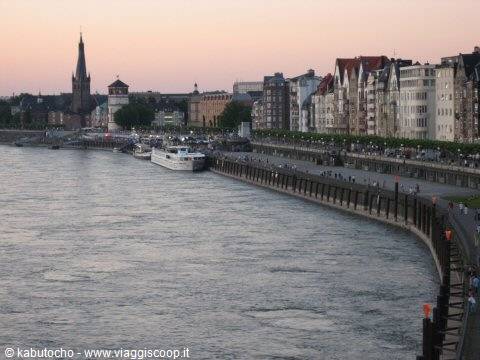 Düsseldorf: Rhine riverside promenade at dusk, buildings and church spire