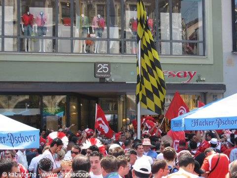 Crowd with flags outside Munich shops during a fan celebration