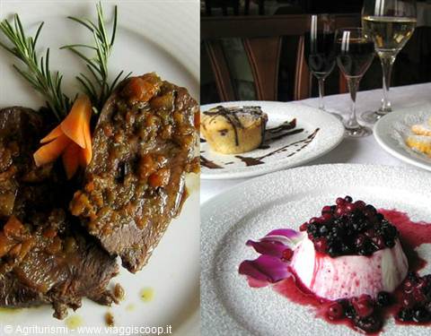Braised meat dish and berry panna cotta with wine glasses on table