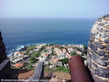 Rusty cannon overlooking the town of Cidade Velha and the ocean