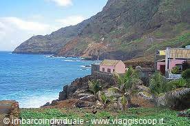 Houses on rocky coast with palm trees and blue sea, Tenerife