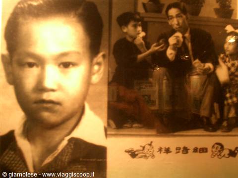 Vintage portrait of a child beside an old family photo
