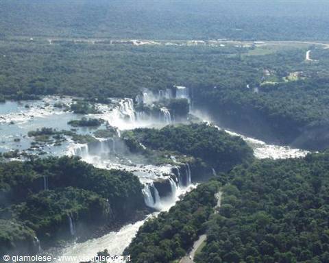 Iguazu Falls from above, rushing water and green forest