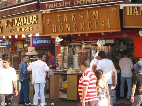 Taksim Dönercisi signs, customers queueing at doner kebab stalls