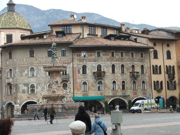 Neptune fountain and frescoed buildings on Piazza Duomo in Trento