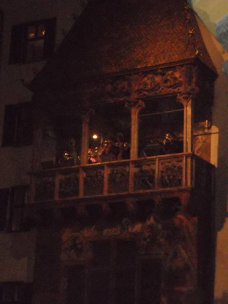 Musicians at night on the Gothic balcony of the Goldenes Dachl, Innsbruck