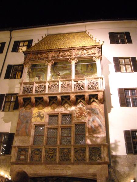 The Goldenes Dachl in Innsbruck at night, gothic balcony with golden tiles