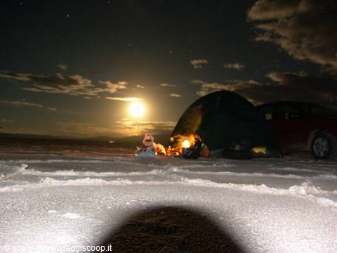 Night camp on Salar de Uyuni: green tent, red SUV, full moon over the salt flat