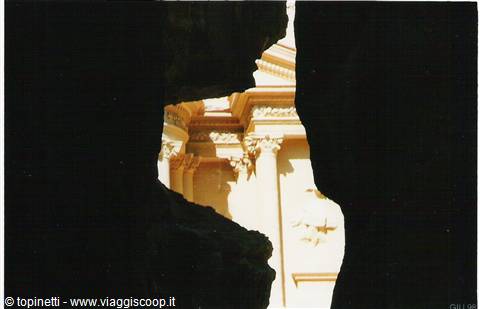 The Treasury of Petra glimpsed through the Siq rocks