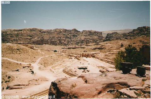 Rocky valley of Petra with sandy paths and ancient ruins