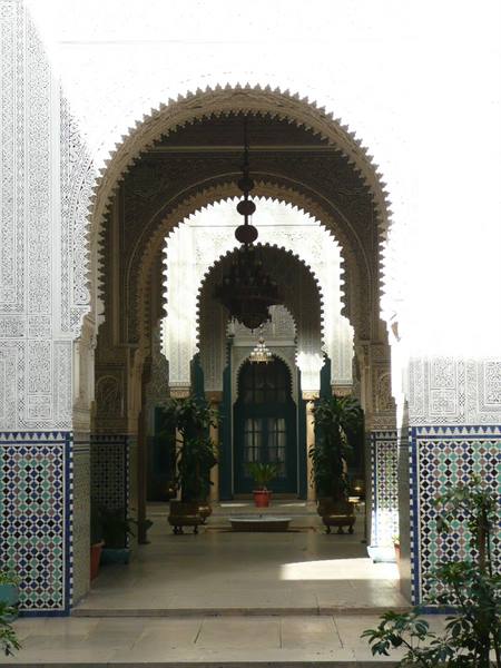 Carved arch and zellige tiles in the Bahia Palace courtyard, Marrakech