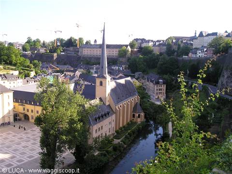 The Grund church with tall spire above the Alzette valley in Luxembourg