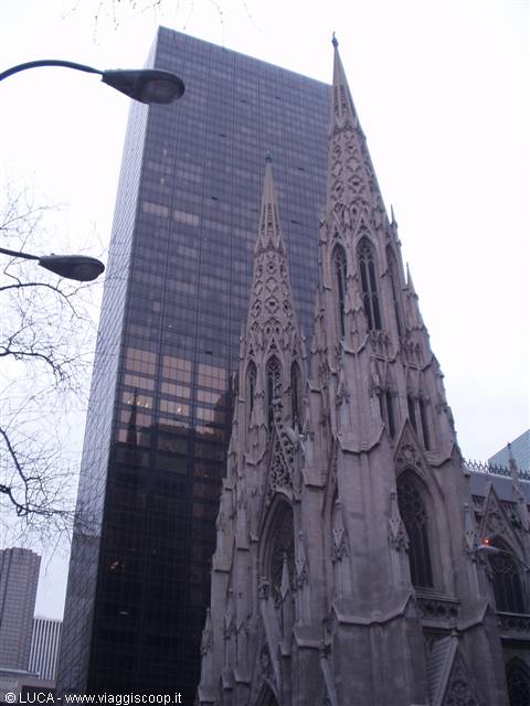 Gothic stone spires of Saint Patrick's Cathedral among New York skyscrapers