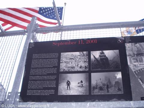 September 11, 2001 memorial panel with photos and American flag at Ground Zero
