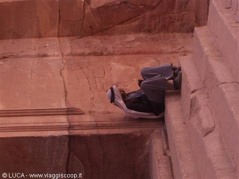 Nomad resting in the shade of the Treasury - Petra