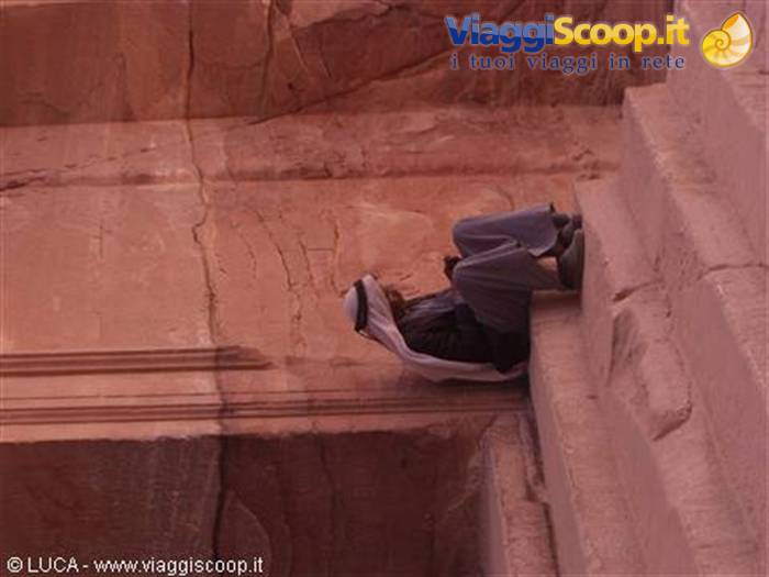 Nomad resting in the shade of the Treasury - Petra