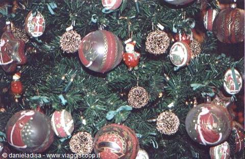 Christmas tree decorated with red and gold glass ornaments