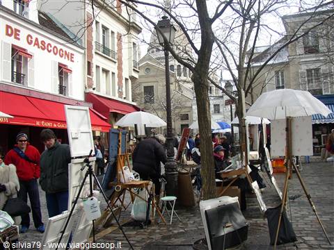 Painters with easels and white umbrellas at Place du Tertre, Paris