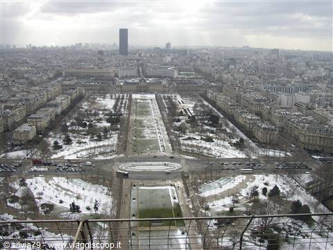 Snowy Champ de Mars seen from the Eiffel Tower, with Montparnasse Tower
