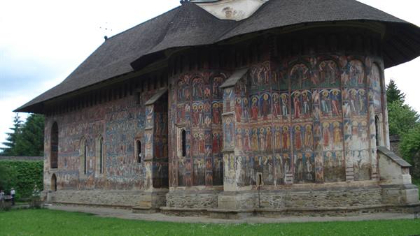 Sucevița painted monastery, sacred frescoes on outer walls, wooden roof