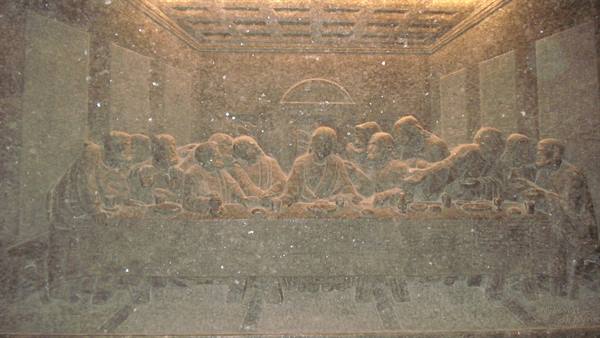 Carved stone relief of the Last Supper, long table with Jesus and apostles
