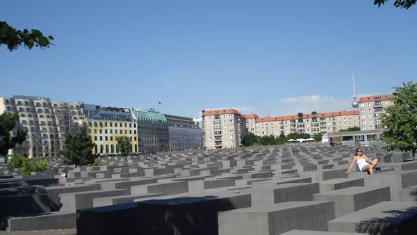 Woman sitting on the concrete slabs of the Holocaust Memorial, Berlin
