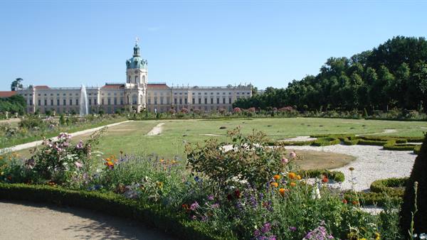 Flower beds and fountain in front of Charlottenburg Palace, Berlin, sunny light