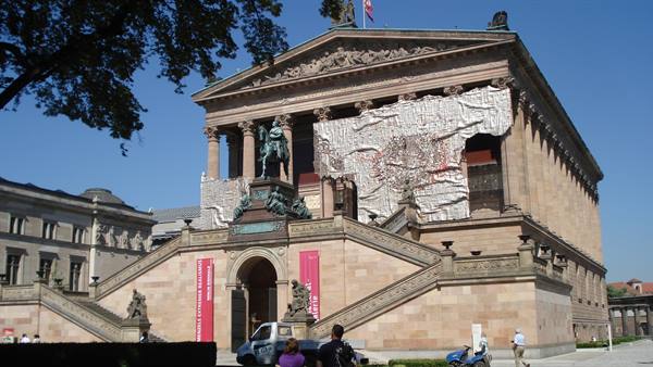 Alte Nationalgalerie in Berlin, stone facade with bronze equestrian statue, tourists below