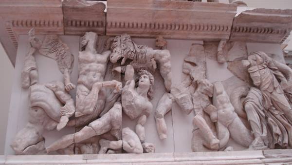Marble frieze of the Pergamon Altar: giants battling, museum in Berlin