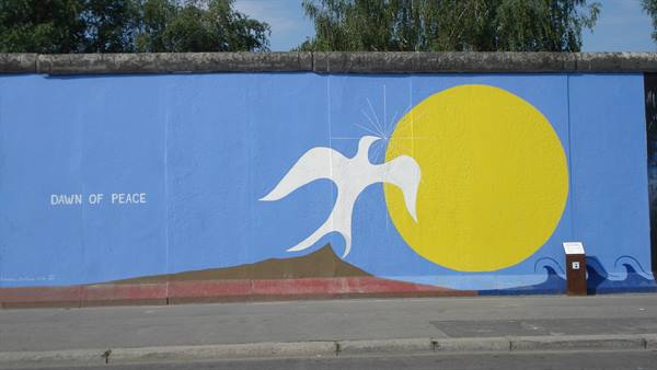 'Dawn of Peace' mural with white dove and yellow sun, East Side Gallery