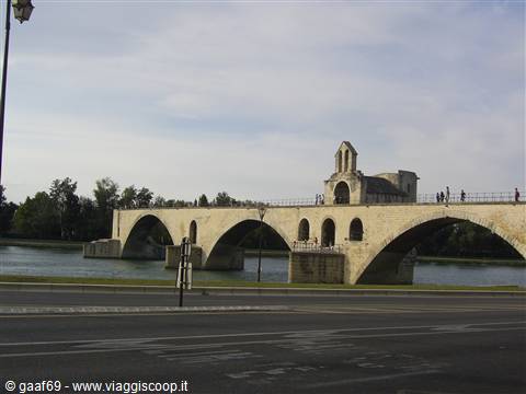 Saint-Bénézet bridge in Avignon, stone arches over the Rhône under cloudy sky