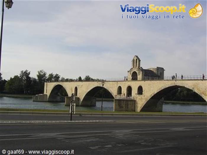 Saint-Bénézet bridge in Avignon, stone arches over the Rhône under cloudy sky