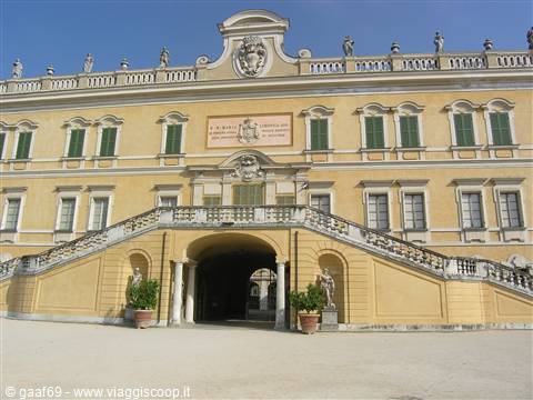 Villa della Porta Bozzolo in Casalzuigno: yellow facade with double stone staircase