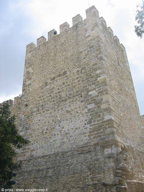 Crenellated stone tower of São Jorge Castle in Lisbon