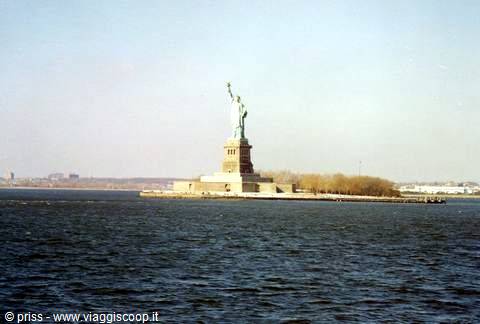 The Statue of Liberty on Liberty Island, seen from the ferry across the bay waters
