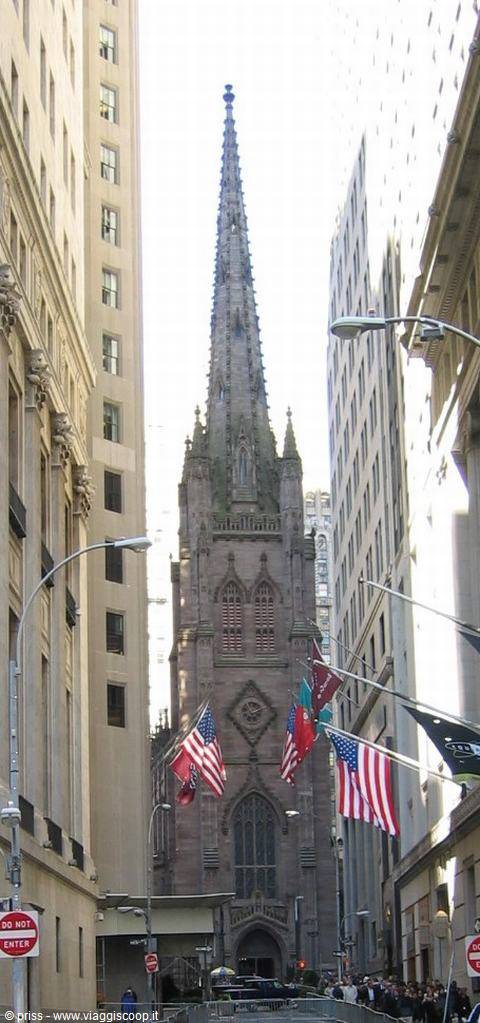 Trinity Church's Gothic spire rising between Wall Street skyscrapers
