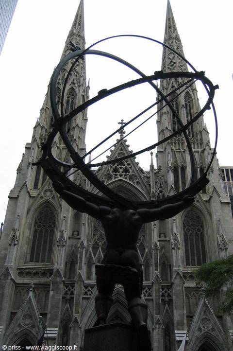 Bronze Atlas statue holding the celestial spheres in front of St Patrick's Cathedral