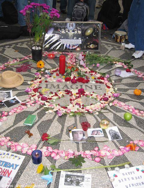 Imagine mosaic at Strawberry Fields, Central Park, covered with flowers, candles and Lennon tributes