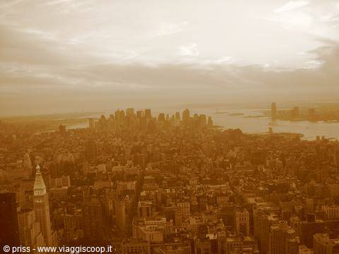 Manhattan skyline in haze from above, skyscrapers and Hudson river