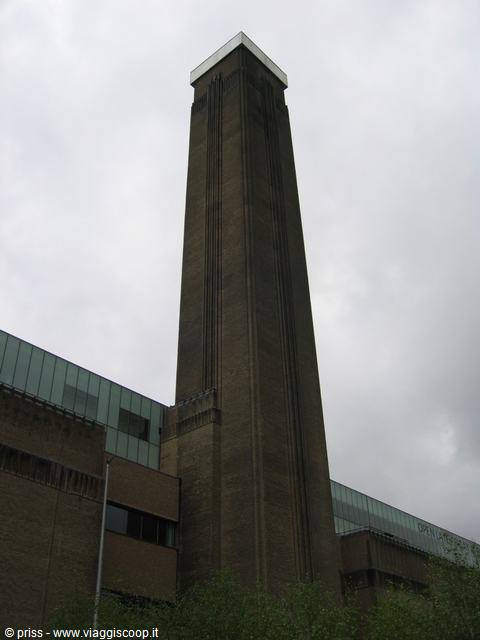 The brick chimney of Tate Modern against a grey sky