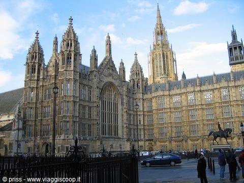 Gothic facade of the Palace of Westminster with stone spires and statue
