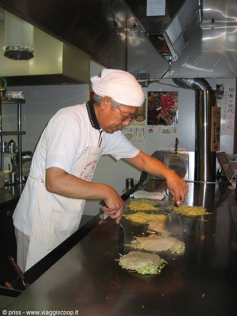 preparing the okonomiyaki