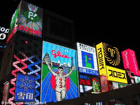 Neon signs at night in Dotonbori, Osaka, featuring the famous Glico running man billboard