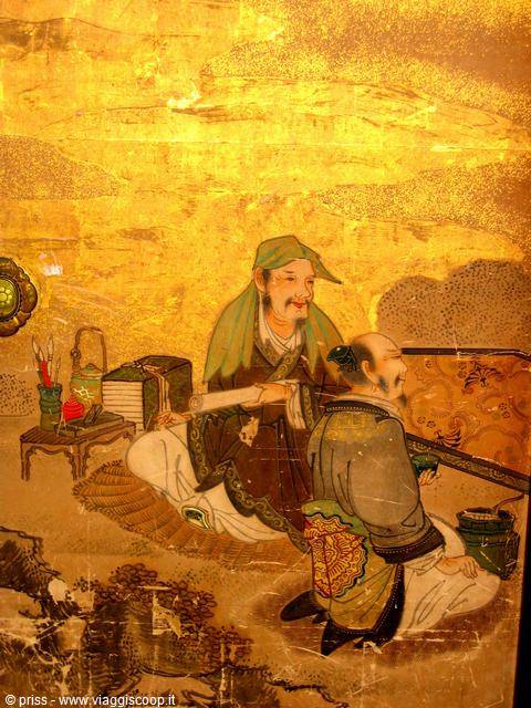 Painting on golden background, two Japanese figures in kimono reading scrolls and books