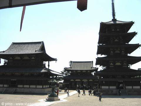 Five-story wooden pagoda and temple halls at Hōryū-ji, visitors in the sunlight