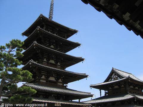 Five-story wooden pagoda of Hōryū-ji temple against a blue sky