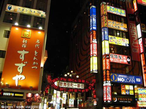 Glowing neon signs at night in Kabukichō, Shinjuku, Tokyo