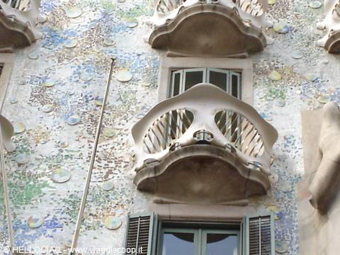 Trencadís facade of Casa Batlló in Barcelona with sculpted stone balconies