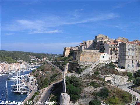 Bonifacio's fortified citadel overlooks the harbor full of boats